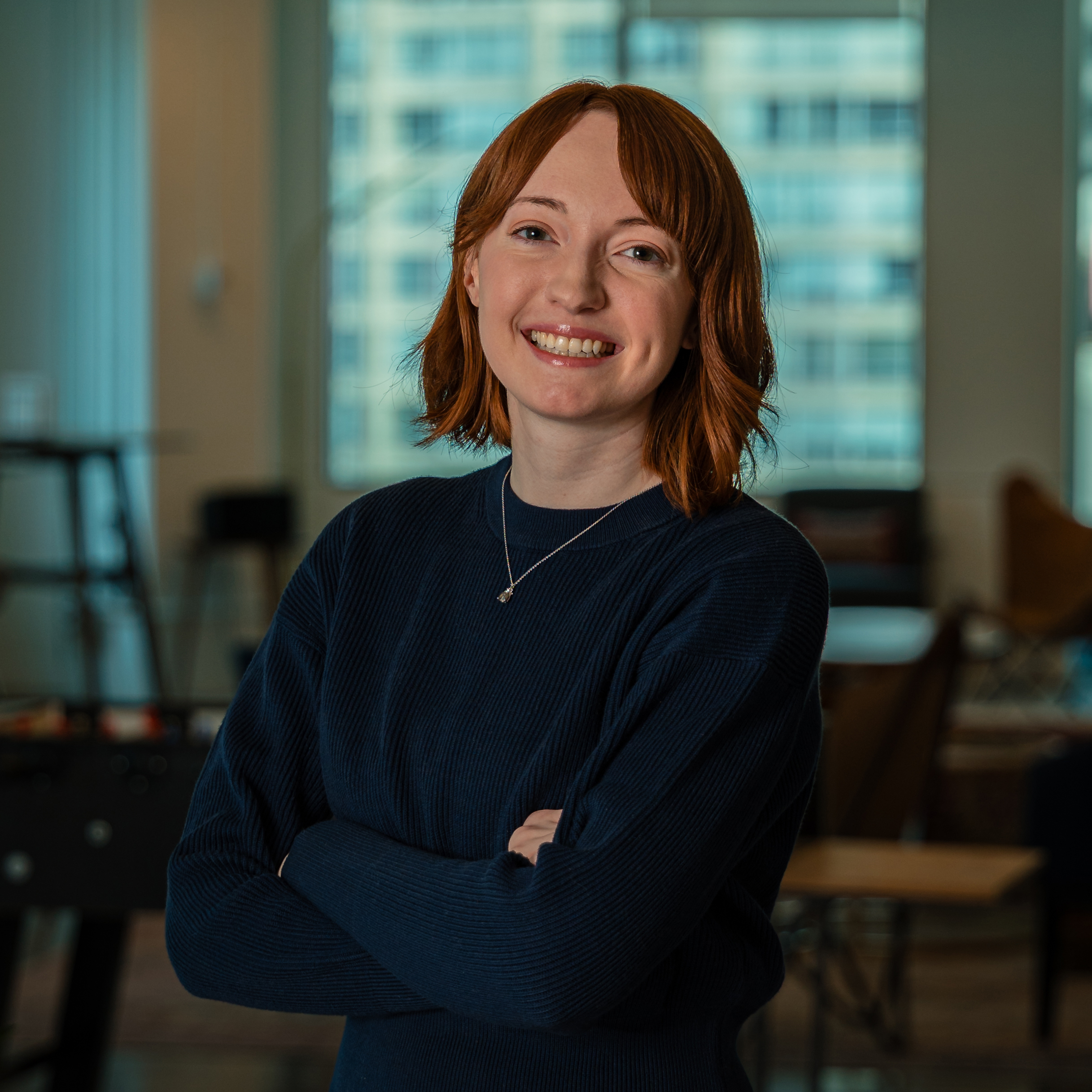 Alicia Symons smiling in an office