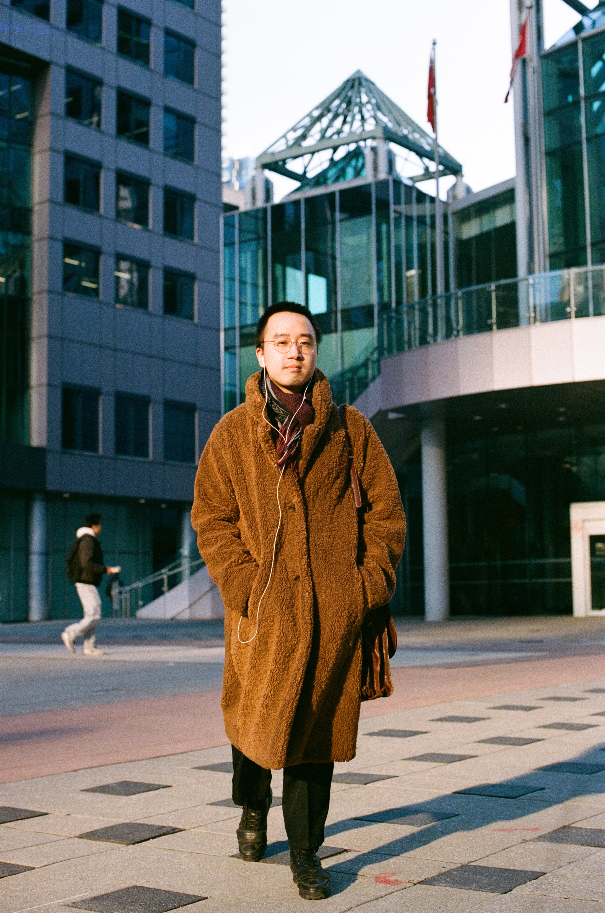 Jun Nguyen standing outside in downtown Toronto