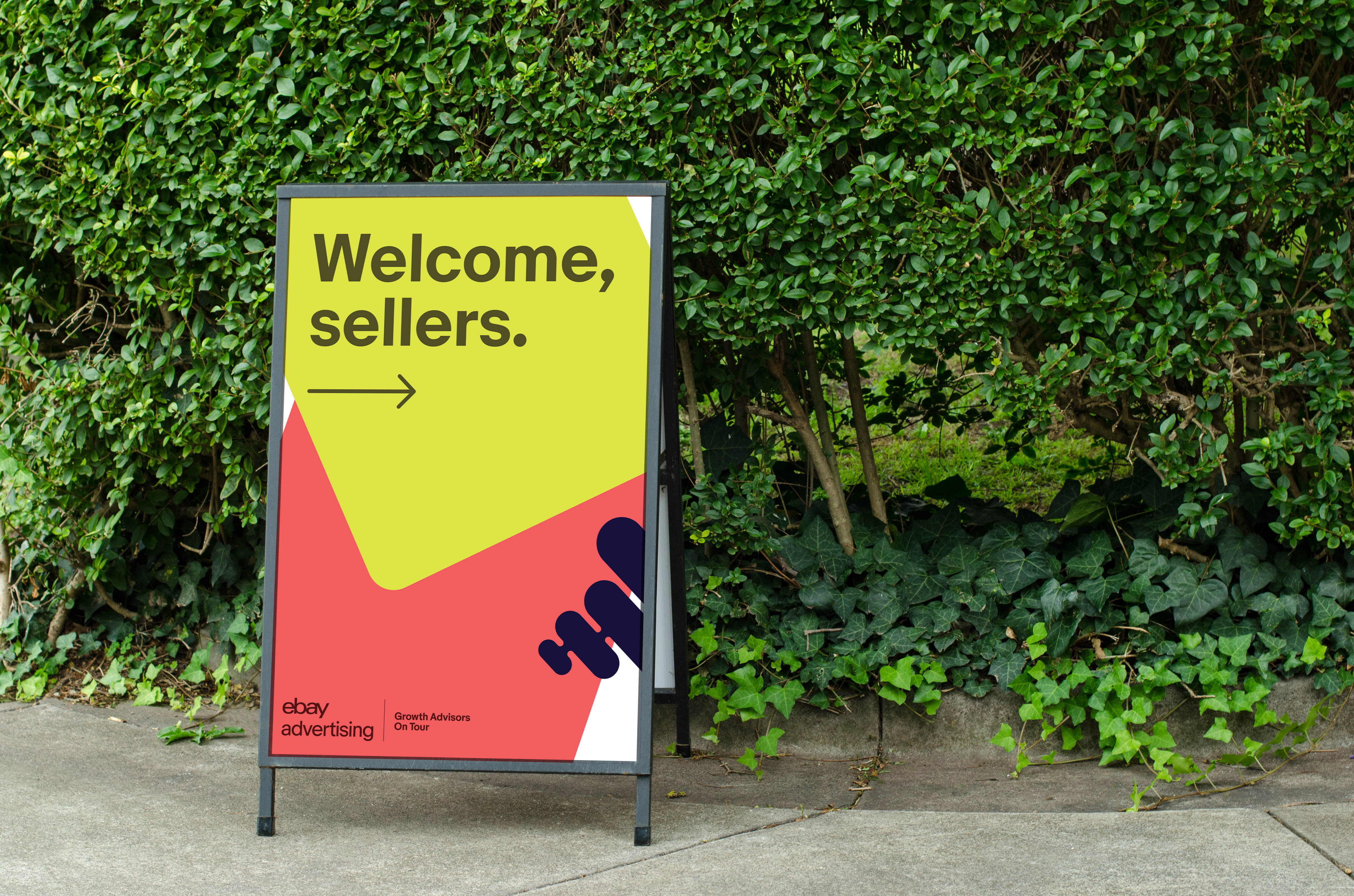 eBay Advertising welcome sign surrounded by greenery